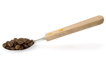 spoon with coffee beans over white background