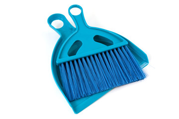 blue shovel and brush over white background