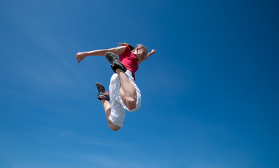Beautiful woman jump into sky