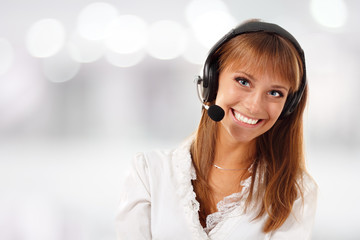 Support phone operator beautful young woman in headset at workpl