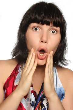 Portrait of a surprised girl on a white background