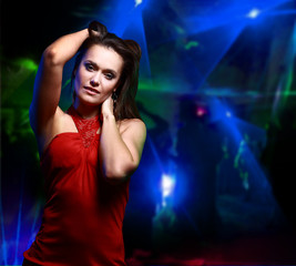 Fototapeta premium Beautiful young woman dancing in the nightclub
