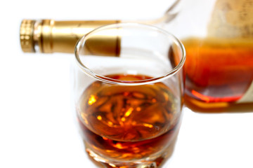 Whiskey in a glass,bottle behind
