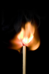Lit Match On Black Background