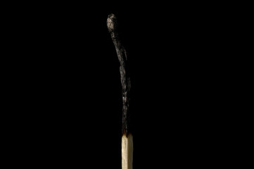 Burnt Match On Black Background