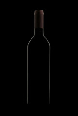 Red Wine Bottle On Black Background In Studio