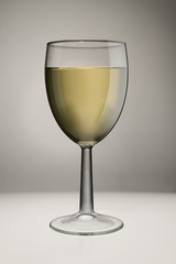 Glass Of White Wine On White Background In Studio