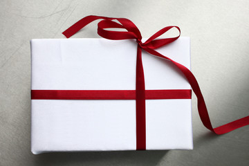 Close up of gift box with red bow