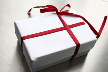 Close up of gift box with red bow