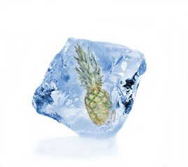 Pine-apple frozen in ice cube, isolated on white background