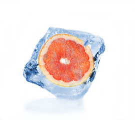 Frozen slice of grapefruit in ice cube