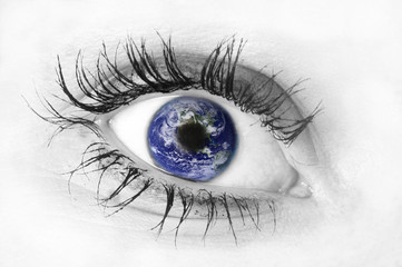 Human eye with planet Earth reflection