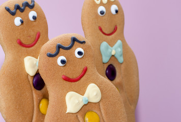 Gingerbread men isolated on pink background