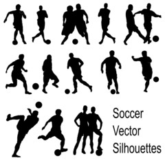 Silhouettes of playing soccer