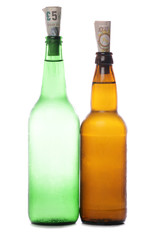 Beer and cider bottles with sterling money