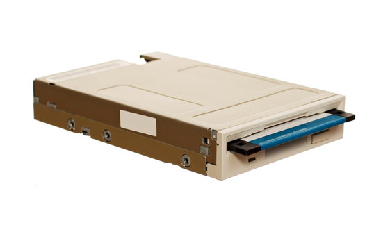 Floppy disk drive with diskette isolated over white