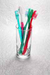 Toothbrushes in Glass