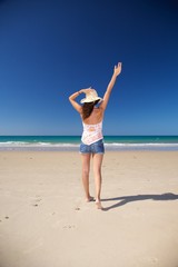 happy straw hat woman at beach