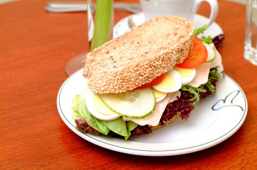 Ham sandwich with red pepper and leaf lettuce