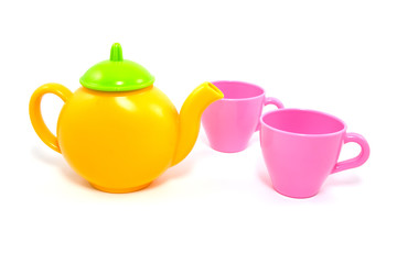 colorful teapot and cups over a white background