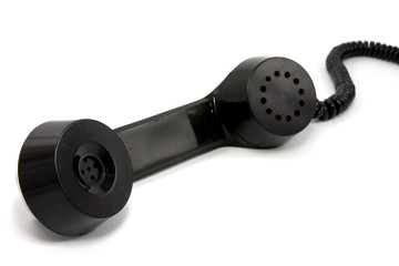 black scratched telephone receiver on white background