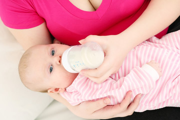 Feeding of the chest baby by a dairy mix