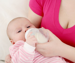 Feeding of the chest baby by a dairy mix