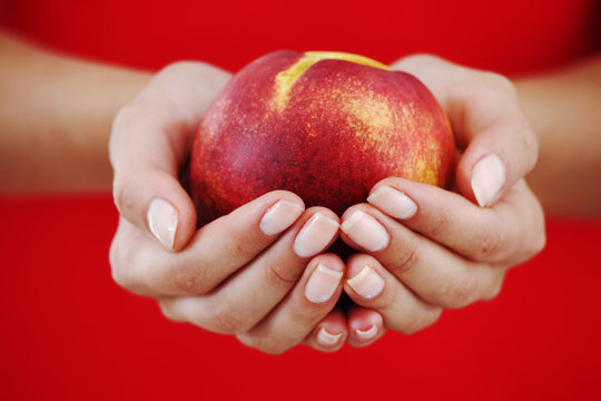 Peach In Woman Hands