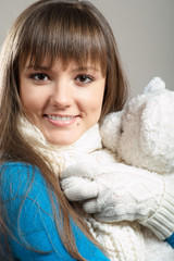 Beautiful winter girl with teddy bear