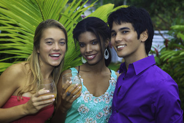 three friends outside in a hawaii garden