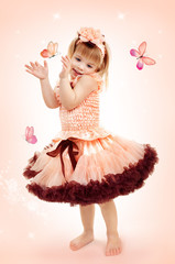 Portrait of the beautiful girl in a pink dress