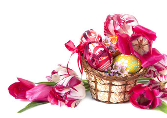 Basket full of Easter eggs and flower