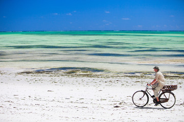 Man biking at beach