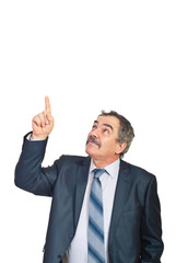 Mature executive pointing upwards to copy