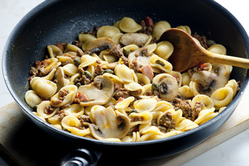 pasta orecchiette with bacon and champignons