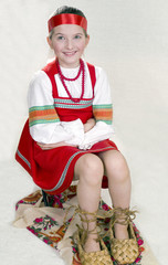 girl in Russian national clothes and the big bast shoes