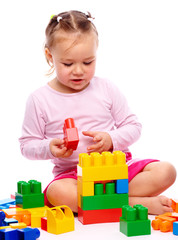 Little girl with building bricks