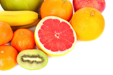 Fototapeta na wymiar Pomegranate, mandarin, banana, , orange, kiwi, grapefruit and a