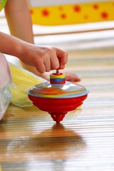child playing with top