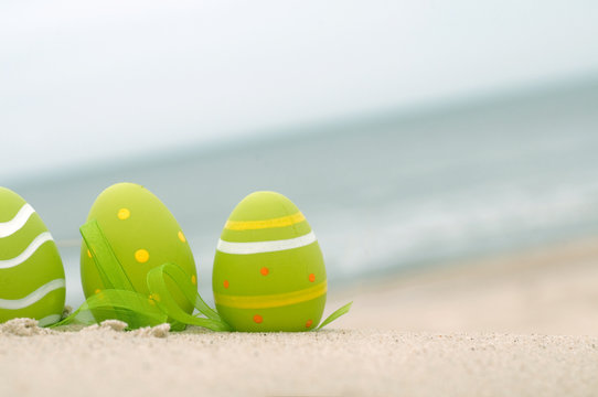 Easter decorated eggs on sand