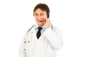 Smiling  medical doctor with headset isolated on white.