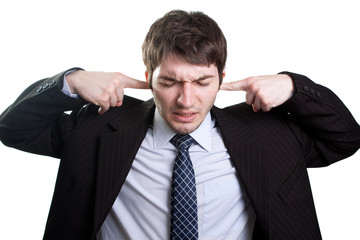 Stress and noise concept of businessman covering ears