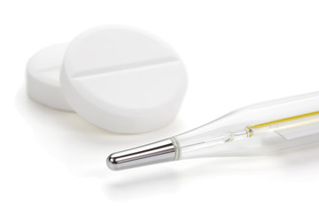 Medical thermometer and tablets.