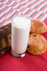 Fresh bread with glass of milk