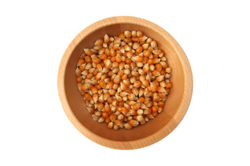 Corn grains in the wooden bowl