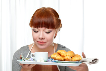 housewife holding tray with breakfast