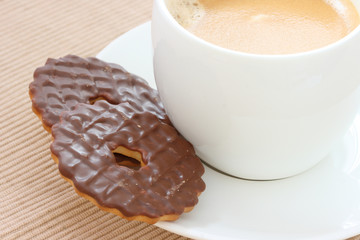 Chocolate biscuits on saucer with coffee