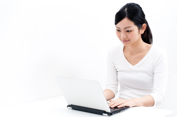 beautiful asian woman using laptop