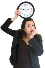 Shocked businesswoman with clock