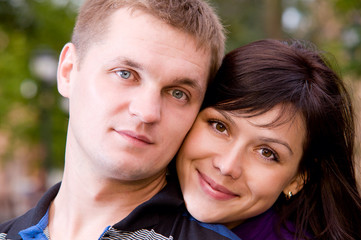 Fototapeta premium portrait of happy smiling couple looking at camera